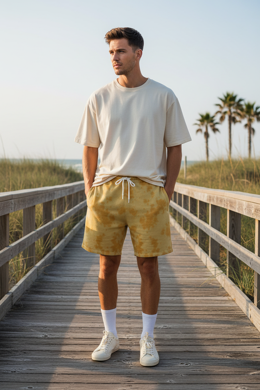 Male model mustard yellow tie dye shorts